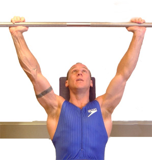 extend arms up straight - keeping your back pushed into the bench